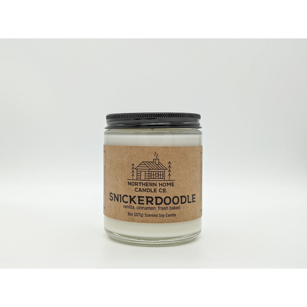 
                  
                    Load image into Gallery viewer, 8 ounce soy candle with brown label that reads northern home candle and snickerdoodle. 
                  
                