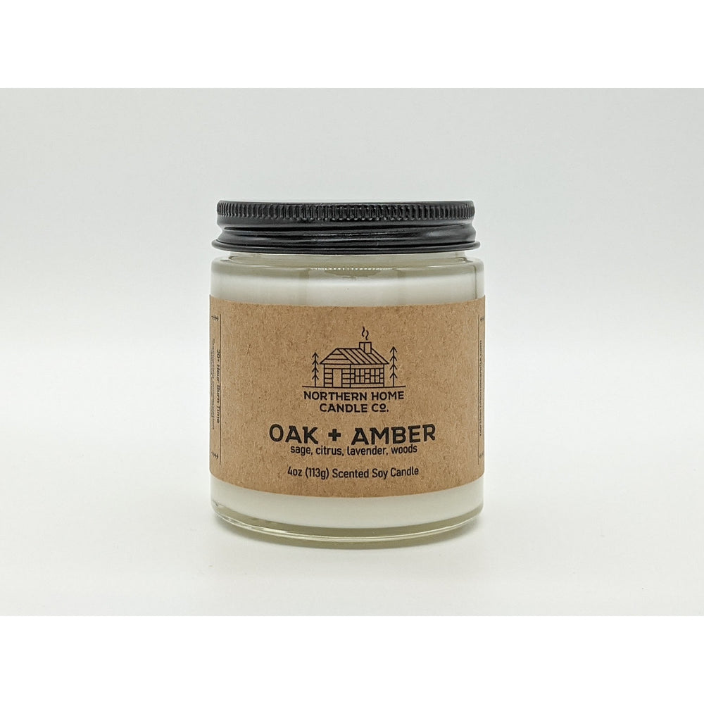 
                  
                    Load image into Gallery viewer, 4 ounce soy candle with a brown label that reads northern home candle and oak and amber.
                  
                