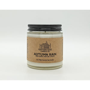 
                  
                    Load image into Gallery viewer, Soy candle with brown label that reads northern home candle and autumn rain surrounded by a white background. 
                  
                