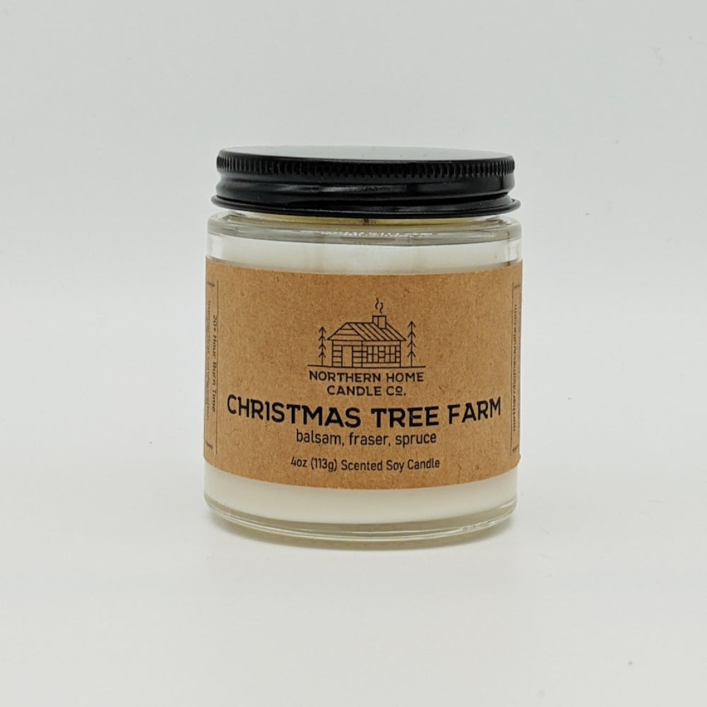 
                  
                    Load image into Gallery viewer, Soy candle with brown label that reads northern home candle and Christmas Tree Farm surrounded by a white background. Label also reads balsam, fraser, and spruce.
                  
                
